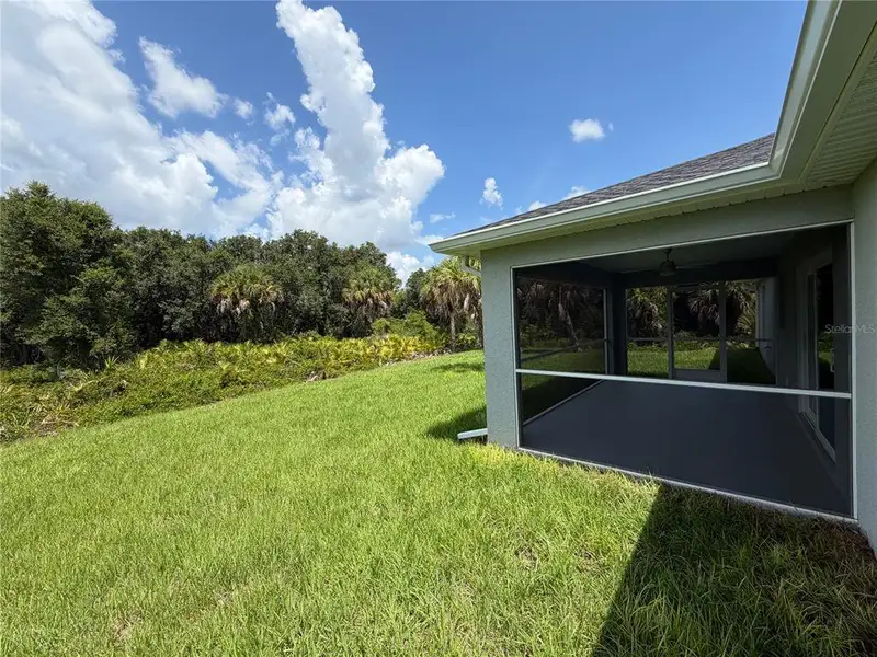 Exterior details and patio area of a home in , North Port (Image 24).