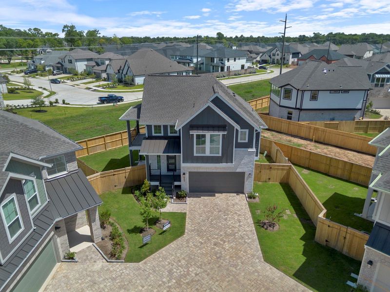 Front exterior of a new home in Sienna, Missouri City, TX, highlighting curb appeal (Image 2). Front exterior of a new home in Sienna, Missouri City, TX, highlighting curb appeal (Image 2).