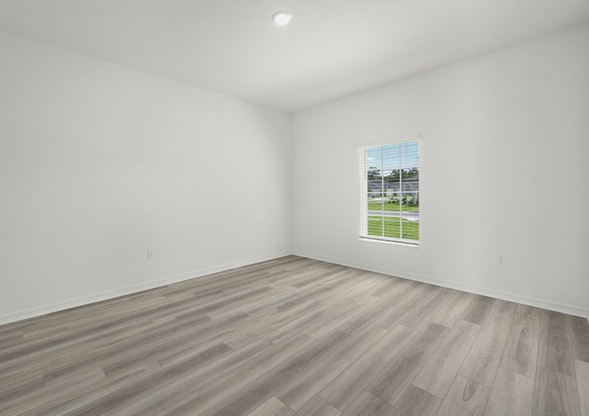 Dining room with faux wood blinds on the window