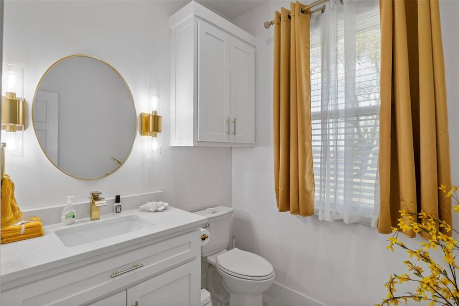 Bathroom featuring vanity and toilet Bathroom featuring vanity and toilet