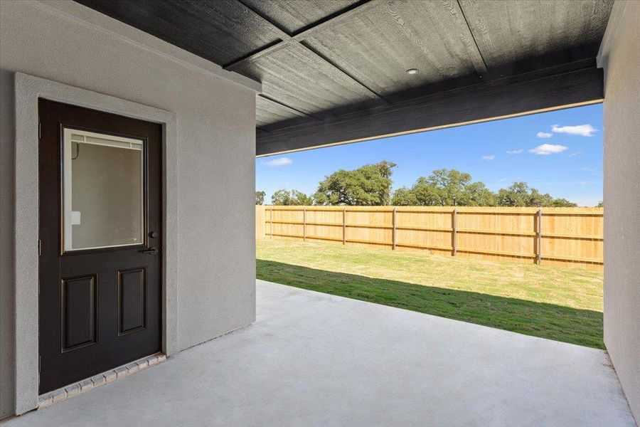 Fenced backyard featuring a patio area