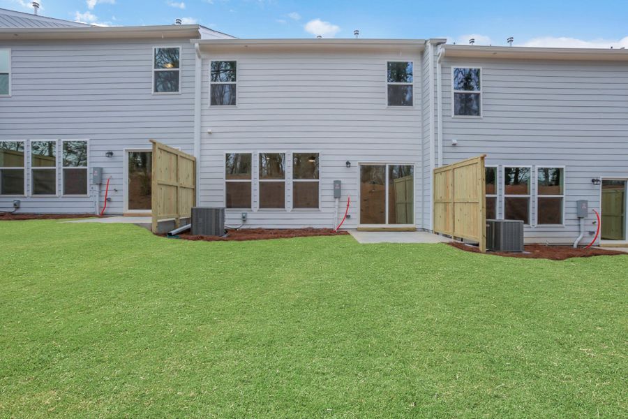 Exterior details and patio area of a home in Villas at Dawsonville Townhomes, Dawsonville (Image 25).