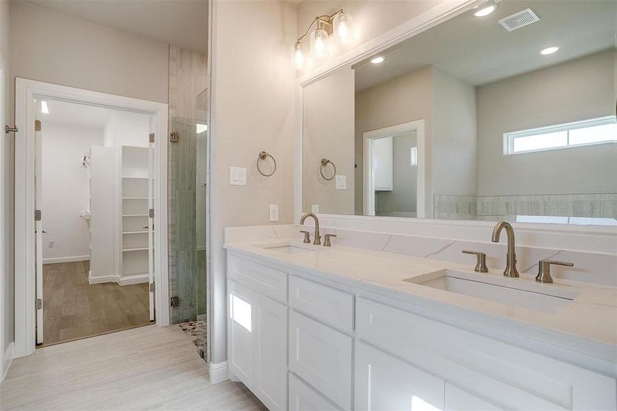 Bathroom with vanity and walk in shower