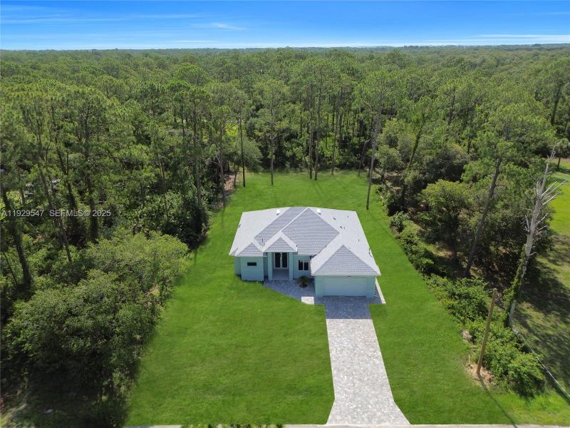 Front exterior of a new home in , Lehigh Acres, FL, highlighting curb appeal (Image 18). Front exterior of a new home in , Lehigh Acres, FL, highlighting curb appeal (Image 18).