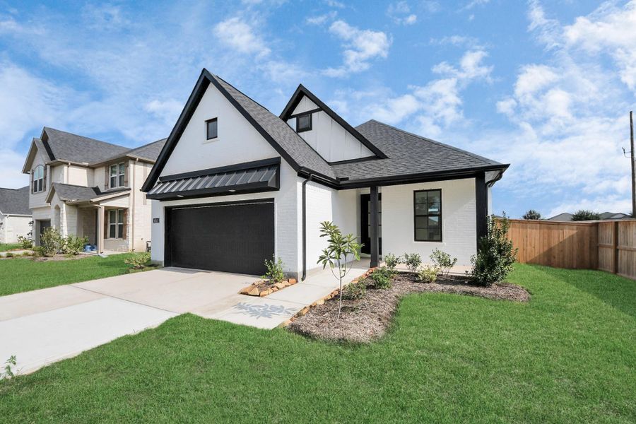 Front exterior of a new home in Arabella on the Prairie: Premier Collection, Richmond, TX, highlighting curb appeal (Image 2). Front exterior of a new home in Arabella on the Prairie: Premier Collection, Richmond, TX, highlighting curb appeal (Image 2).