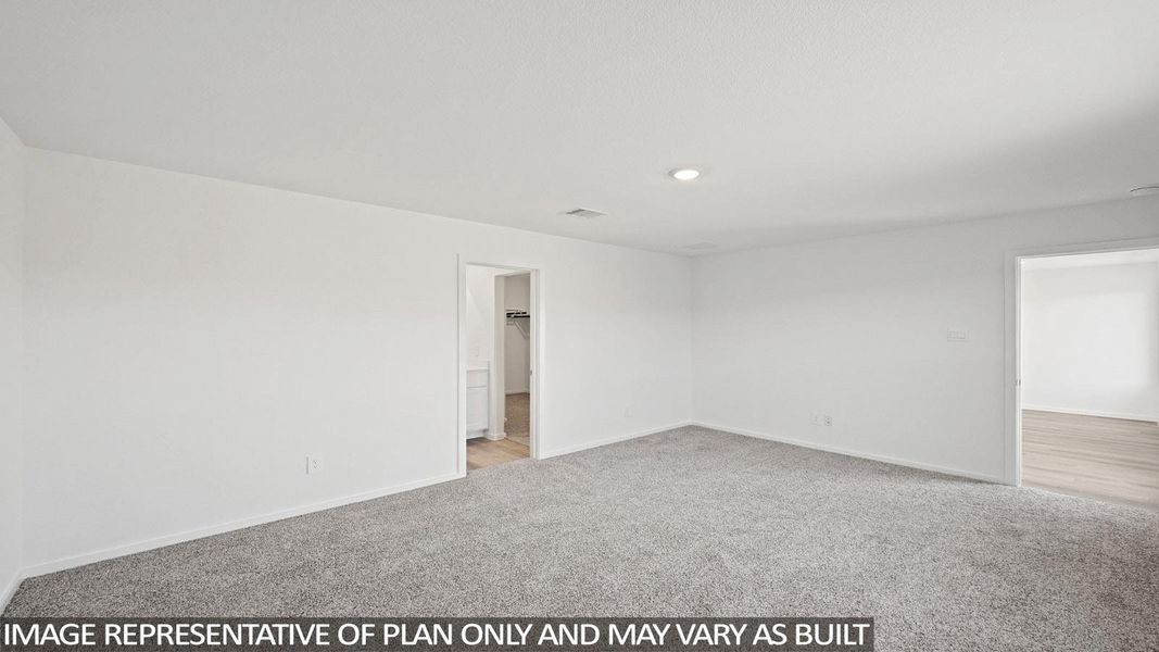 Unfurnished room featuring light carpet and baseboards