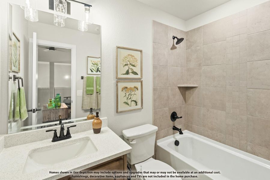 Bathroom with quartz vanity, white tub-shower combo with beige tile surround, and large mirror Bathroom with quartz vanity, white tub-shower combo with beige tile surround, and large mirror