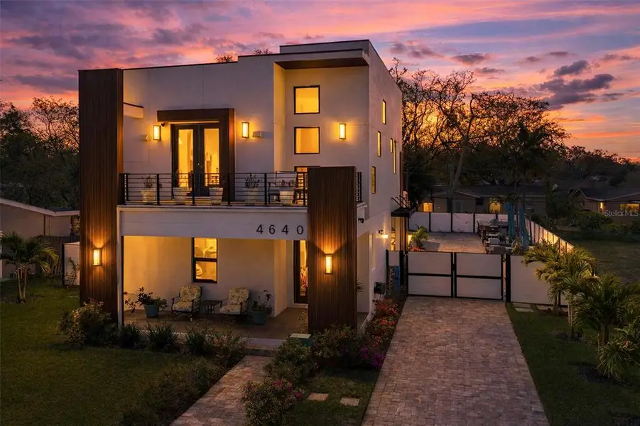Front exterior of a new home in , St. Petersburg, FL, highlighting curb appeal (Image 1). Front exterior of a new home in , St. Petersburg, FL, highlighting curb appeal (Image 1).