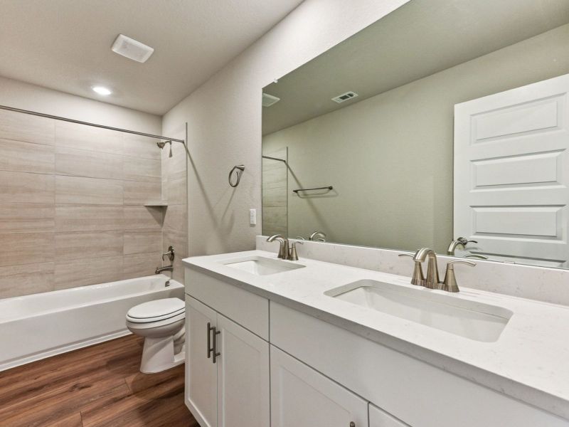 Furnished interior view inside a new home in Big Sky Ranch - Executive Collection, Dripping Springs (Image 8).