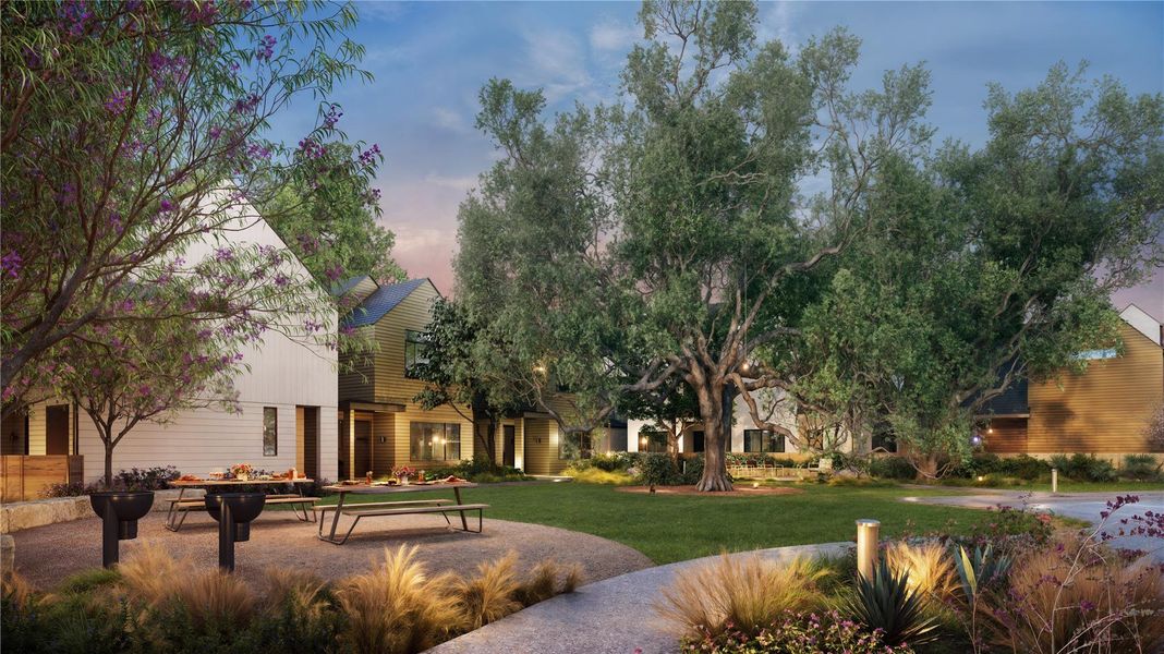 View of community featuring an outdoor fire pit, a yard, and a patio area