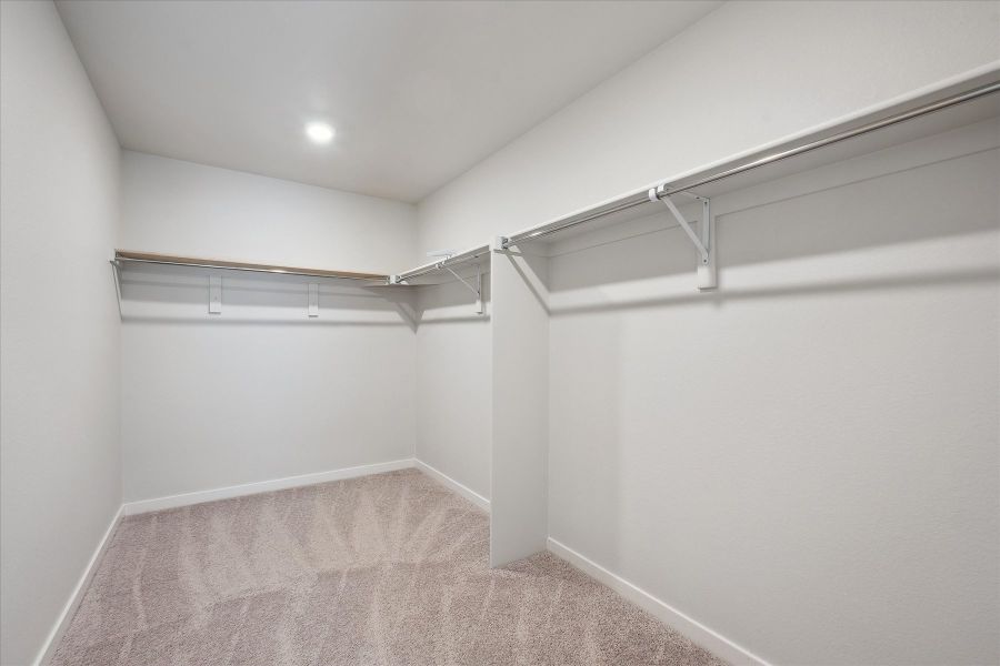 A white room with a metal railing.