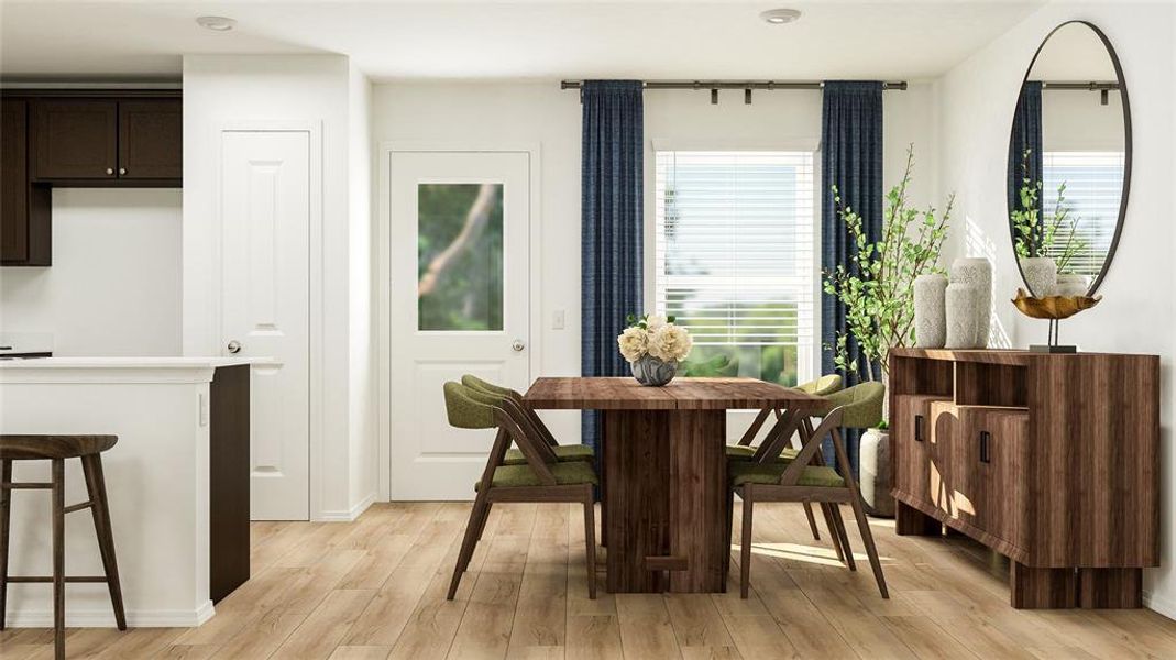 Dining space with light wood-type flooring