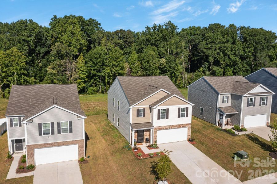 Front exterior of a new home in Mills at Long Creek, Dallas, NC, highlighting curb appeal (Image 19).