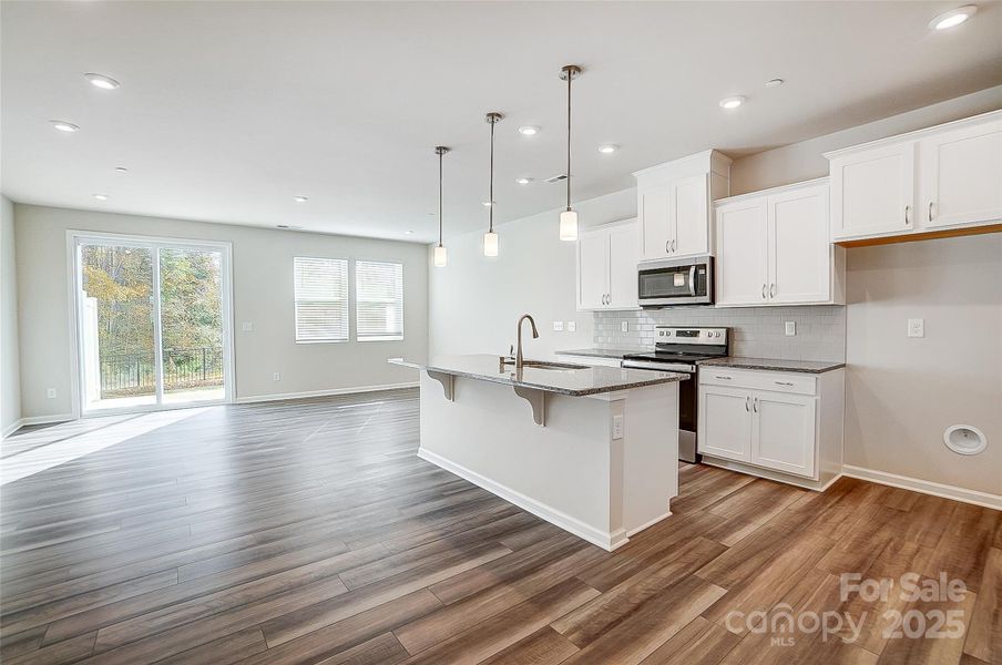 View of Kitchen and Gathering Space-Photo Similar to Subject Property