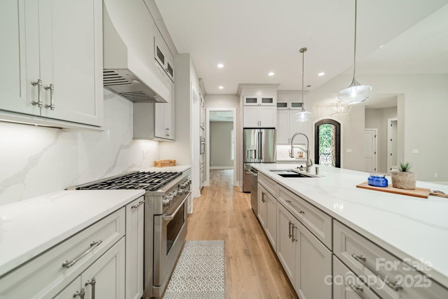 Enjoy the grand Chef's Kitchen and Quartz Island