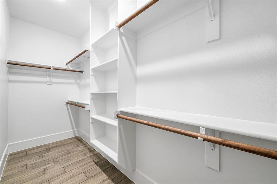 Walk in closet featuring light wood-type flooring