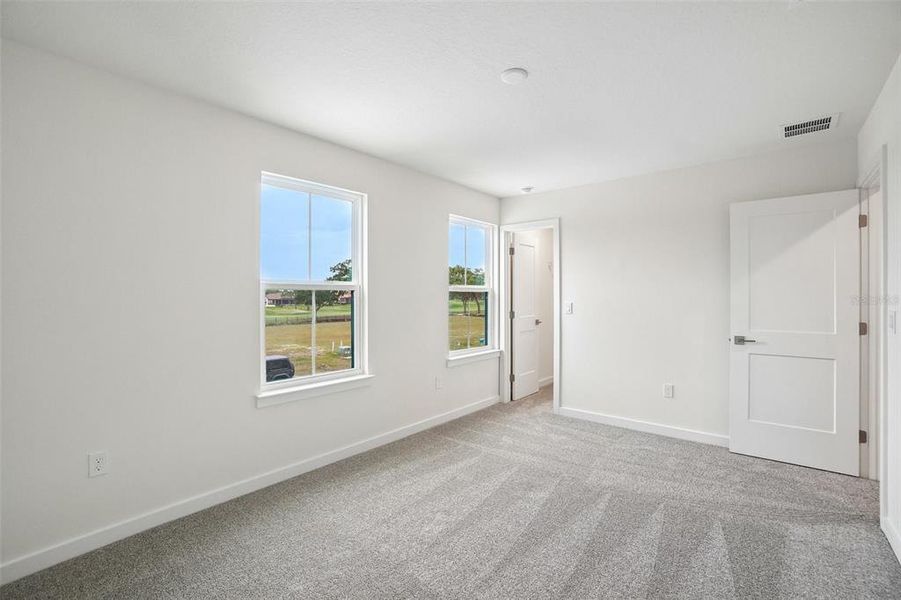 Spacious, unfurnished interior of a new home in Grasslands West, Lakeland (Image 31).