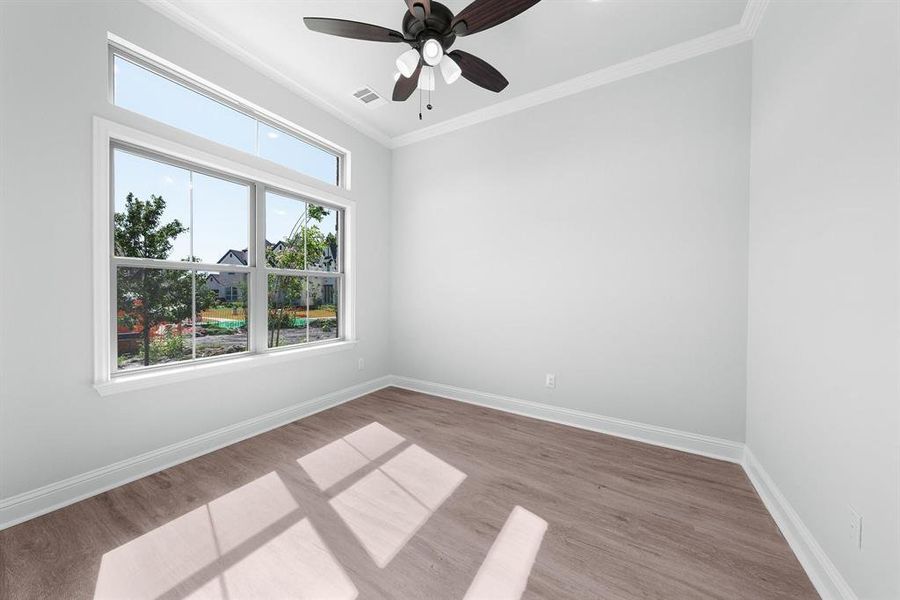 Office featuring crown molding, wood finished floors, and a ceiling fan