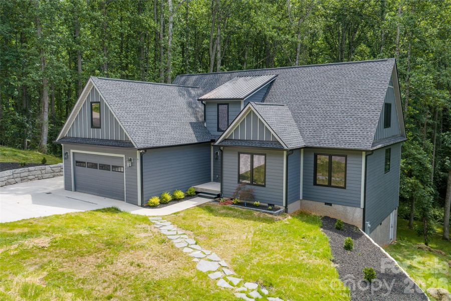 Front exterior of a new home in , Candler, NC, highlighting curb appeal (Image 2).