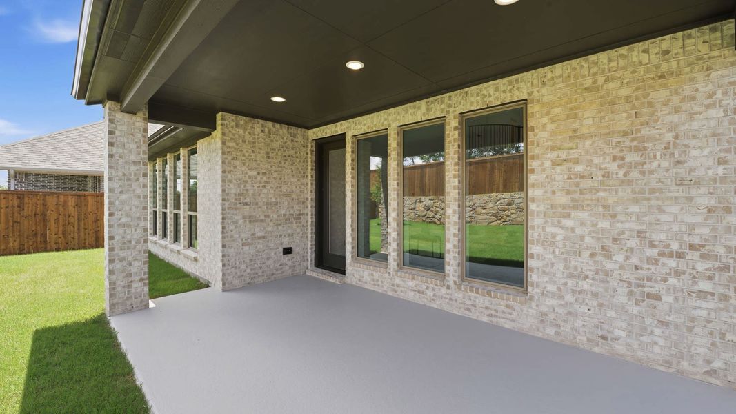 Exterior details and patio area of a home in The Heights at Uptown Celina, Celina (Image 3). Exterior details and patio area of a home in The Heights at Uptown Celina, Celina (Image 3).