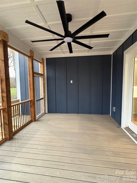 screened in porch- installing a TV on blue wall
