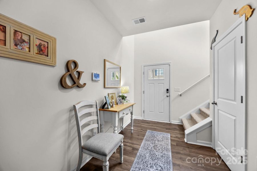 Spacious foyer with walk-in closet for coats and shoes.