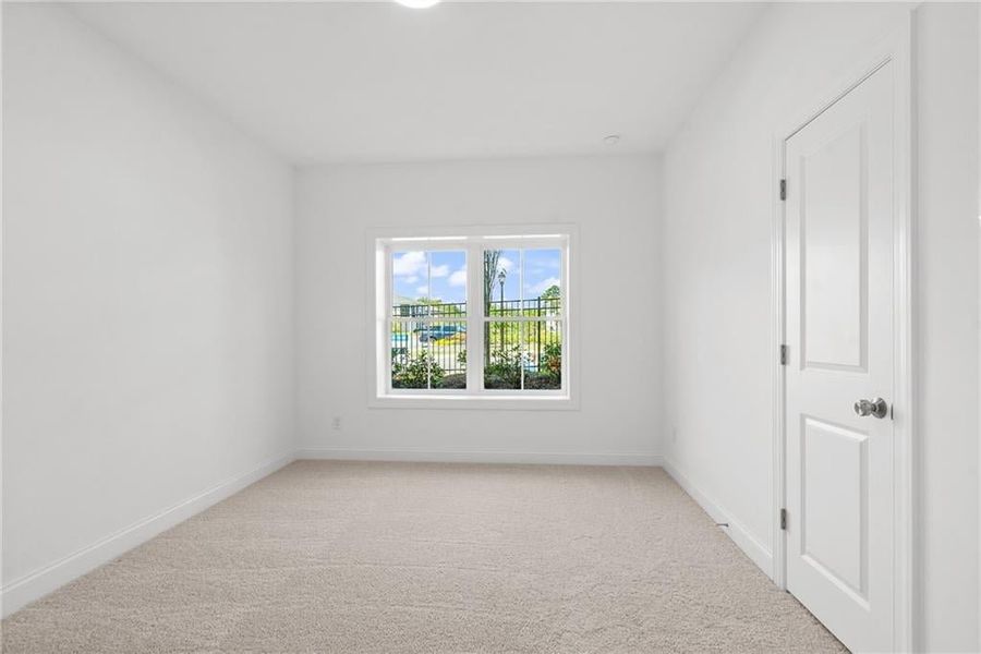 Terrace level bedroom featuring a walk in closet and its own private bathroom