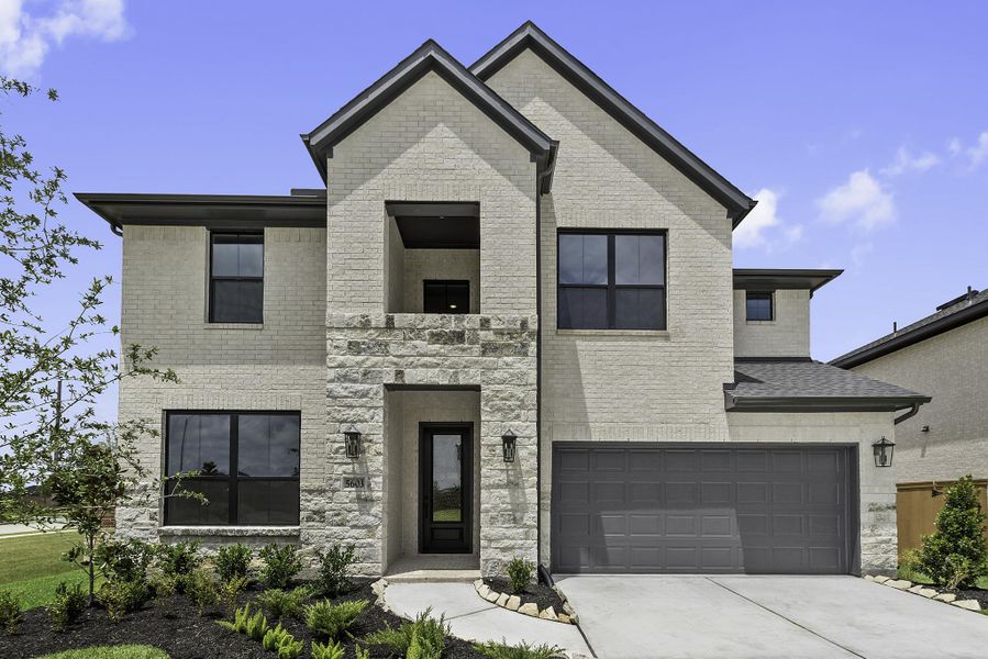 Front exterior of a new home in Sunterra, Katy, TX, highlighting curb appeal (Image 2). Front exterior of a new home in Sunterra, Katy, TX, highlighting curb appeal (Image 2).