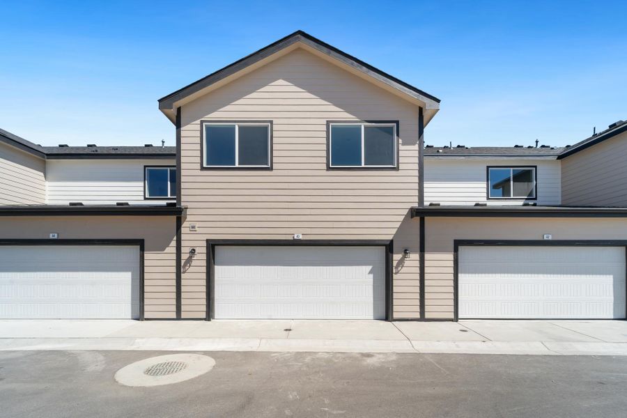 Front exterior of a new home in Conestoga, Ault, CO, highlighting curb appeal (Image 17).