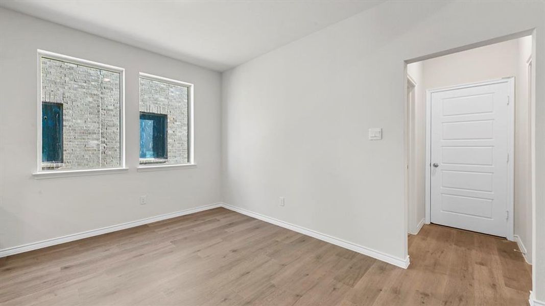 Unfurnished room featuring light wood-type flooring