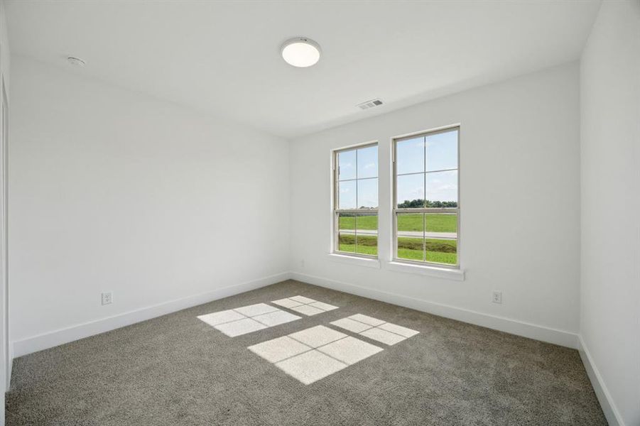 Unfurnished room featuring carpet floors Unfurnished room featuring carpet floors
