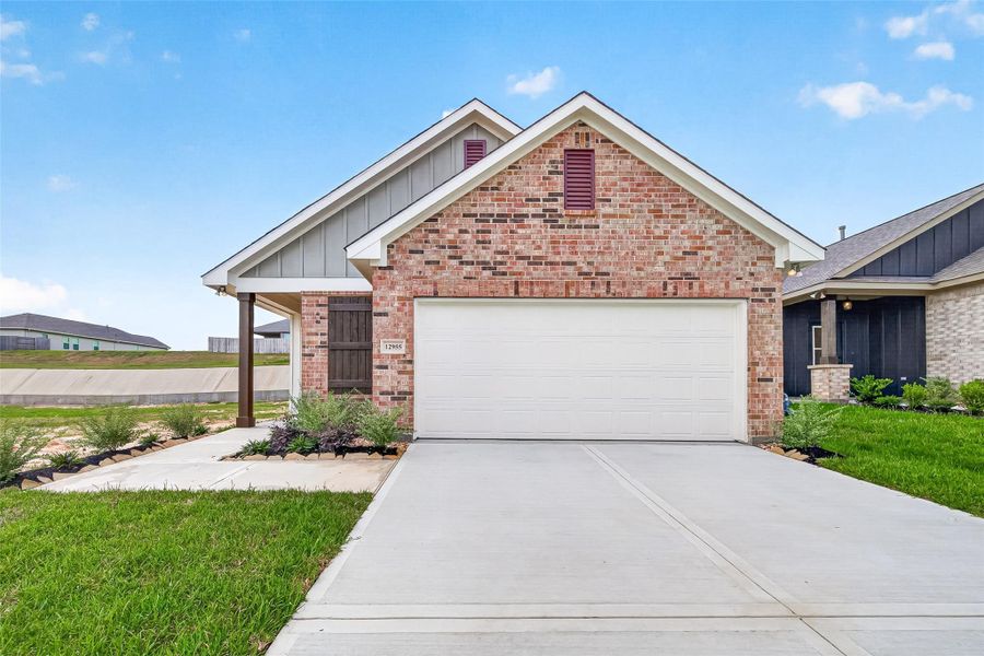Front exterior of a new home in Mostyn Springs, Magnolia, TX, highlighting curb appeal (Image 22). Front exterior of a new home in Mostyn Springs, Magnolia, TX, highlighting curb appeal (Image 22).