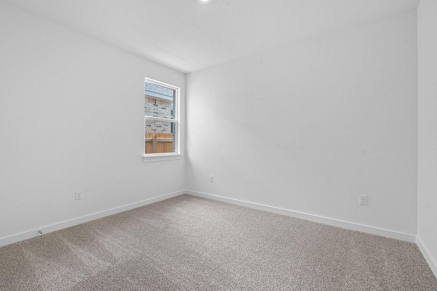 Spare room with carpet and baseboards Spare room with carpet and baseboards