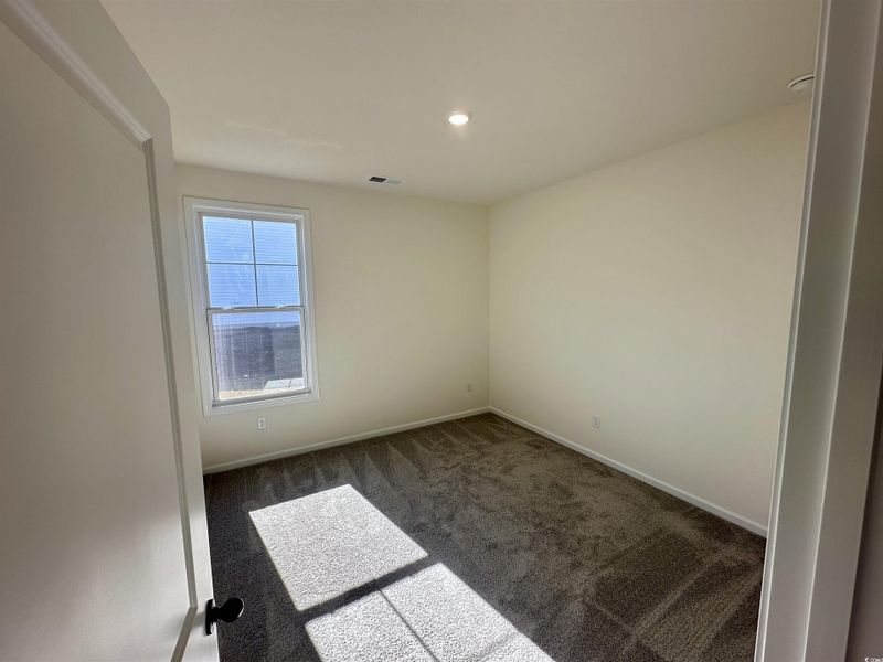 Bedroom featuring carpet and recessed lighting Bedroom featuring carpet and recessed lighting