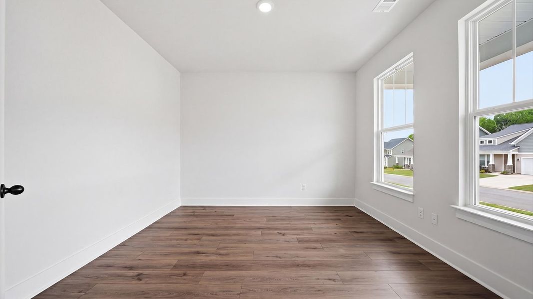 Refined and quiet study behind French doors—perfect for focused work or peaceful retreat