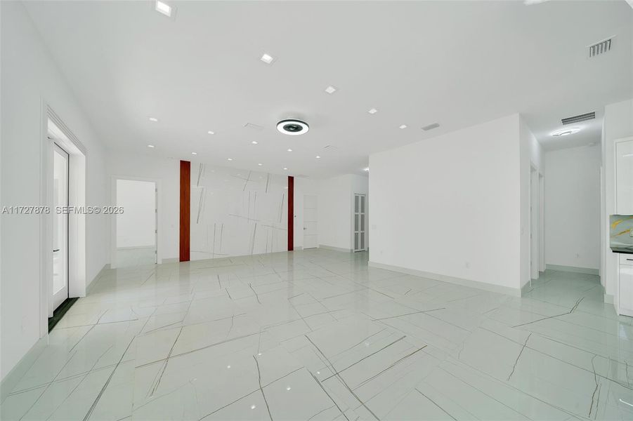 ENTERTAINMENT AREA WATERFALL OF TILE WITH MAHOGANY ACOUSTIC PANEL ENTERTAINMENT AREA WATERFALL OF TILE WITH MAHOGANY ACOUSTIC PANEL