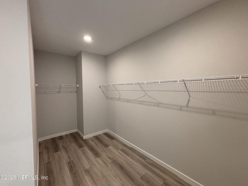 Spacious, unfurnished interior of a new home in The Cypress Series at Reserve East, Flagler Beach (Image 12).