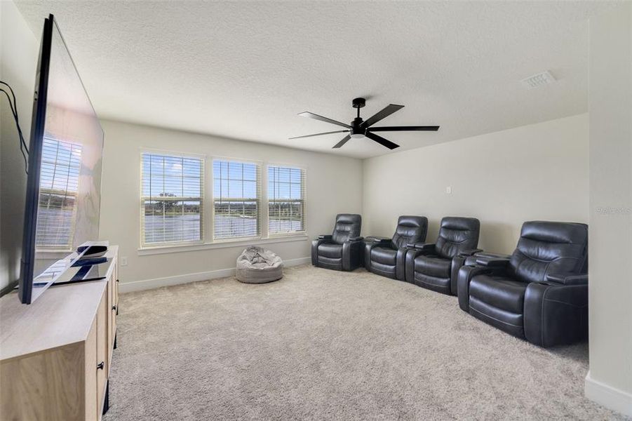 The BONUS/LOFT is pre-wired for full media and the windows on the back of the home provide sweeping views of the retention pond and walking trails that wind throughout this community! Can also become the 7th Bedroom Space!