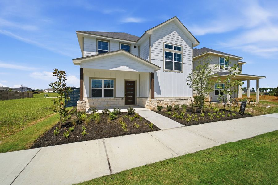 Front exterior of a new home in Austin Point, Richmond, TX, highlighting curb appeal (Image 2).