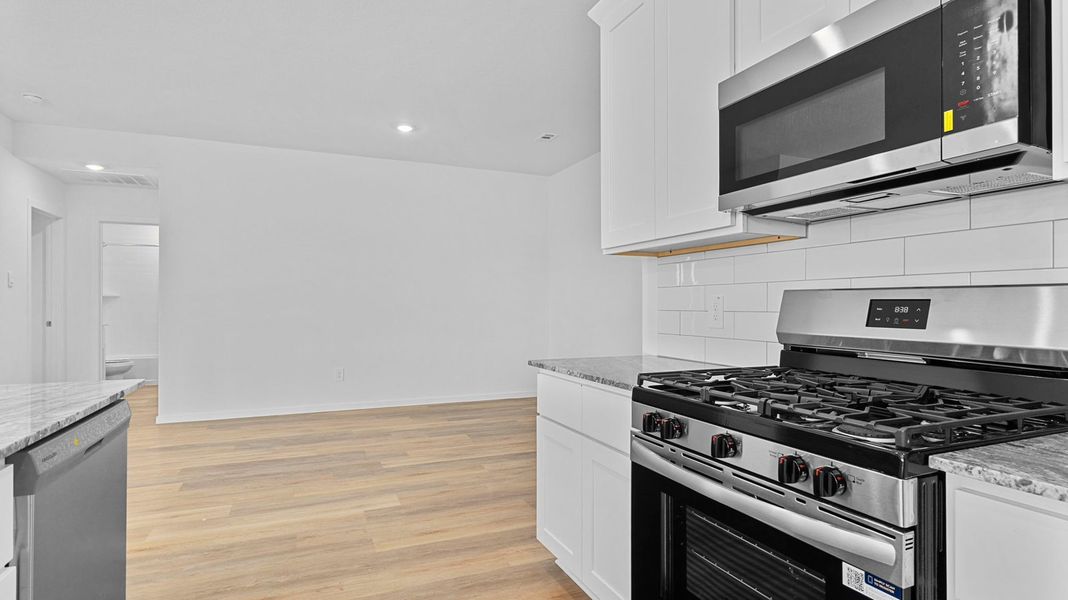 Furnished interior view inside a new home in Caldwell Crossing, Iowa Colony (Image 6).