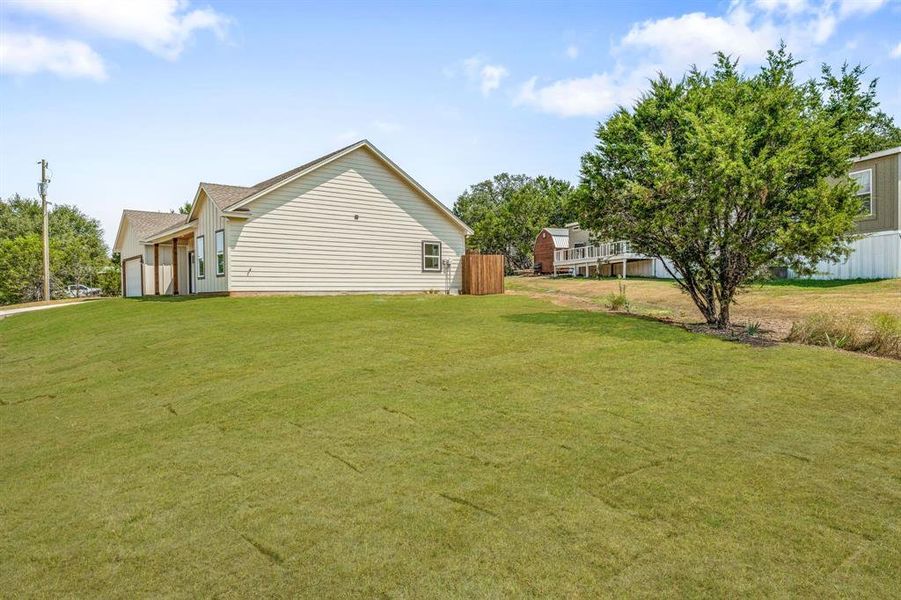 Front exterior of a new home in , Granbury, TX, highlighting curb appeal (Image 19). Front exterior of a new home in , Granbury, TX, highlighting curb appeal (Image 19).