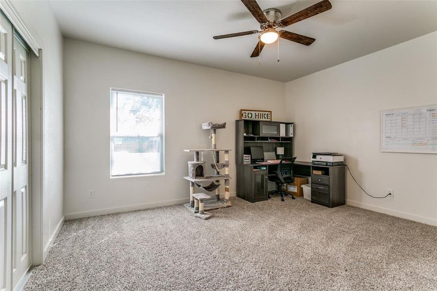 Office space featuring light carpet and ceiling fan Office space featuring light carpet and ceiling fan