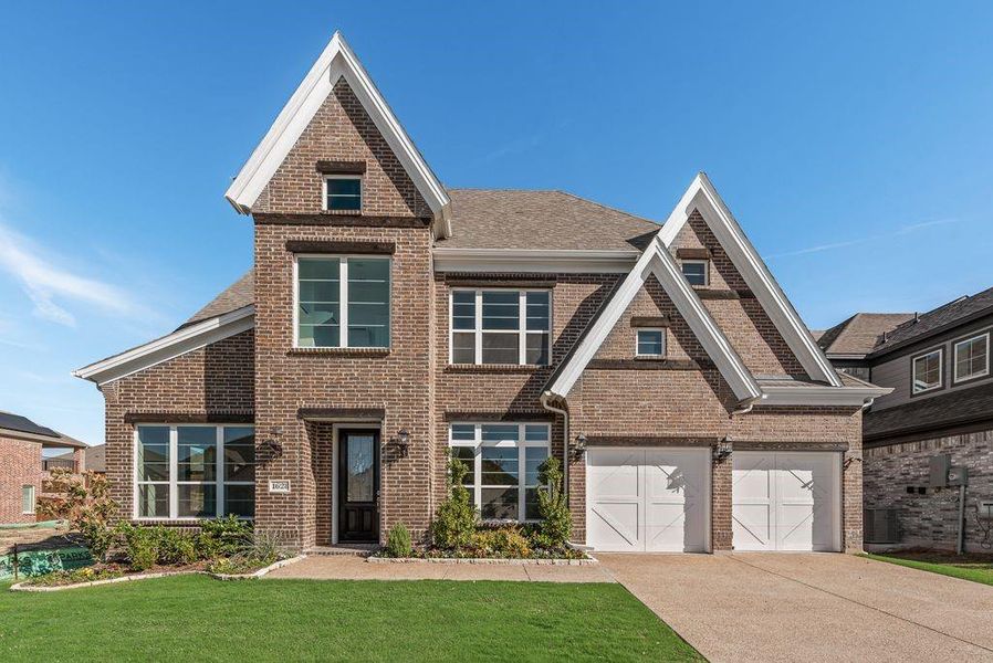 Front exterior of a new home in Monterra, Rockwall, TX, highlighting curb appeal (Image 1). Front exterior of a new home in Monterra, Rockwall, TX, highlighting curb appeal (Image 1).