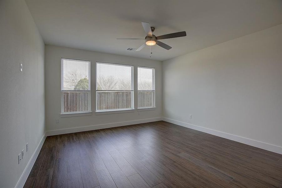 Primary bedroom located at the back of the home adjacent to spa like bathroom