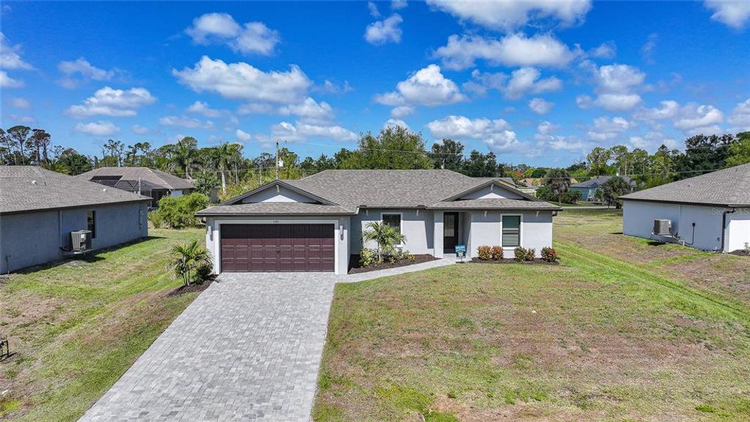 Front exterior of a new home in , Port Charlotte, FL, highlighting curb appeal (Image 29).