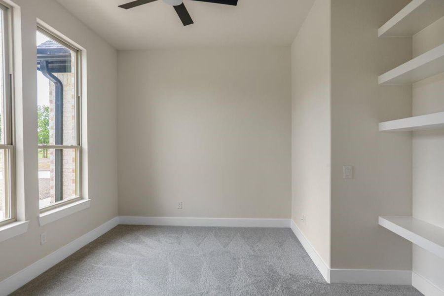 Spare room featuring ceiling fan and carpet Spare room featuring ceiling fan and carpet