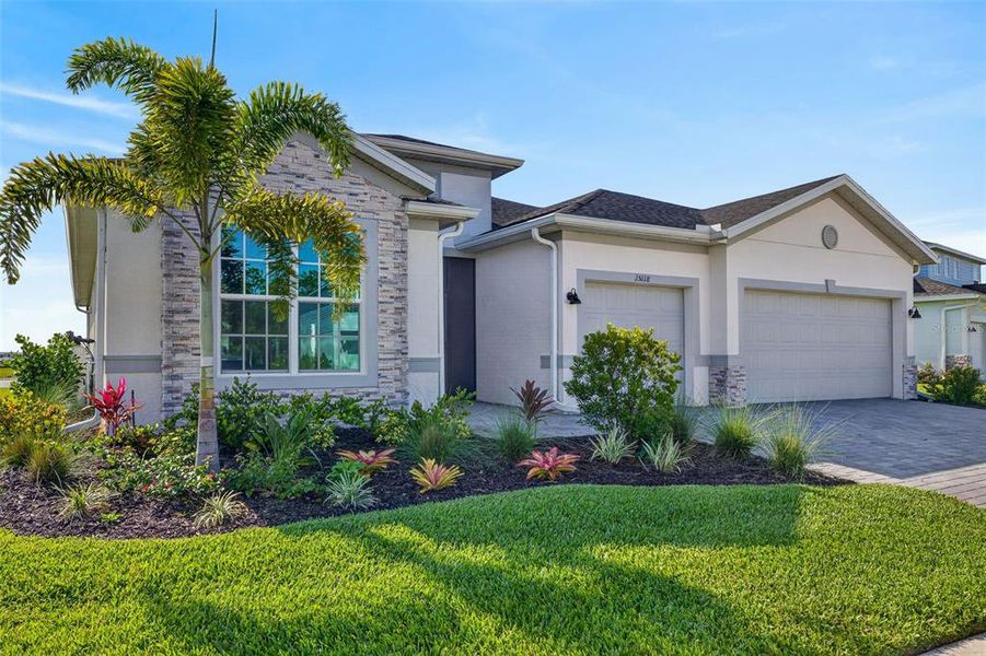 Front exterior of a new home in , Punta Gorda, FL, highlighting curb appeal (Image 1). Front exterior of a new home in , Punta Gorda, FL, highlighting curb appeal (Image 1).