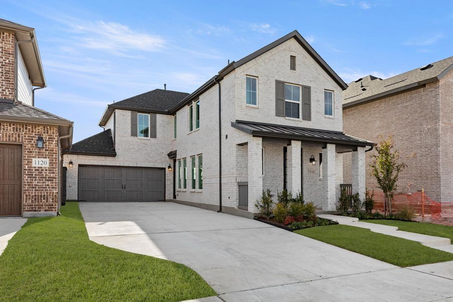 Front exterior of a new home in Garden Collection at Union Park, Little Elm, TX, highlighting curb appeal (Image 2). Front exterior of a new home in Garden Collection at Union Park, Little Elm, TX, highlighting curb appeal (Image 2).