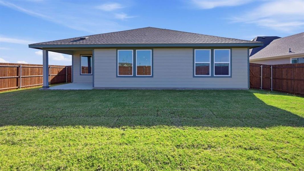 Rear view of property featuring a patio area, roof with shingles, and a fenced backyard Rear view of property featuring a patio area, roof with shingles, and a fenced backyard
