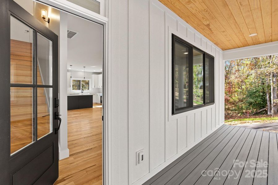 The covered porch and LP Smart Board & Batten Siding welcome you into this fresh open home.